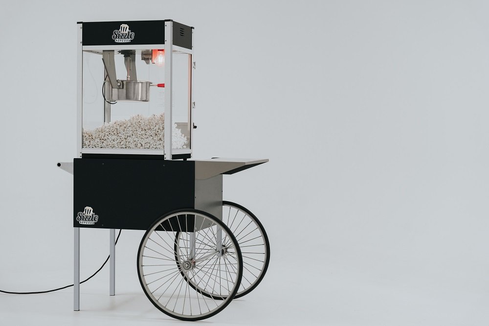 Sizzle Popcorn branded popcorn cart with fresh popcorn